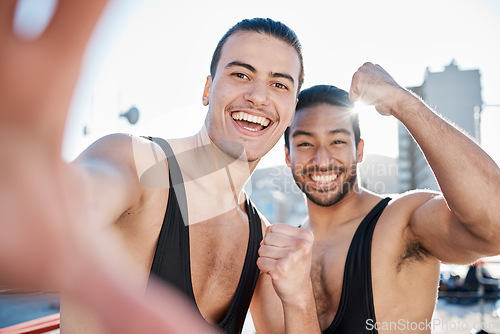 Image of Men, fight and selfie for sport, fitness partnership or smile with fist celebration, pride of outdoor on rooftop. Wrestling friends, happy and memory with photography, social media or profile picture