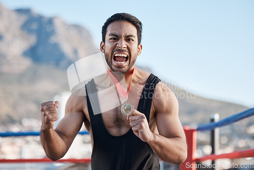 Image of Champion man, wrestling medal and celebration in portrait, success or fist in air for sports contest on roof in Cape Town. Young athlete, games and winner for goal, achievement and fight competition