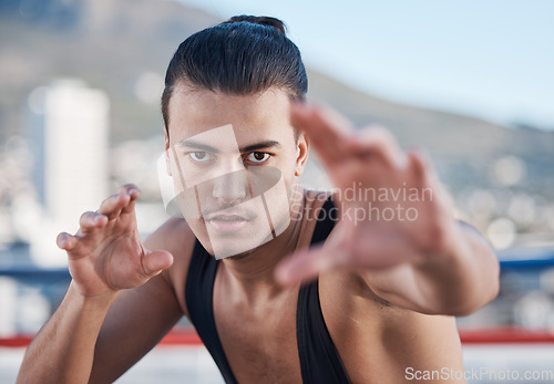 Image of Fight, portrait and a man doing karate in the city, training for taekwondo or sports competition. Serious, fitness and a professional athlete with a move for a workout or martial arts exercise