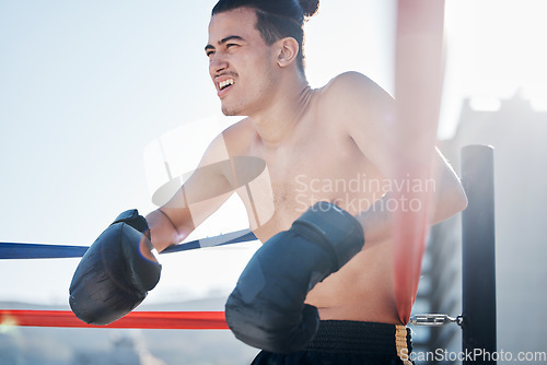 Image of Break, boxing training or tired man fighting in sports exercise, workout or practice match in ring or city. Fatigue, boxer or combat fighter resting in fitness workout battle in ring for self defense
