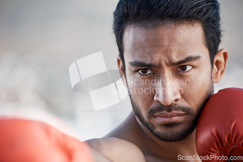 Image of Fitness, man boxing or face of boxer in training, exercise and punching with strong power in workout. Serious, challenge or healthy Asian combat athlete fighting outdoors for mma skills development