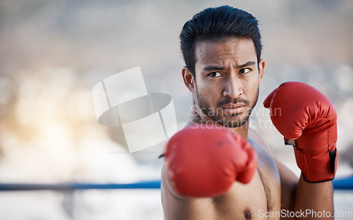 Image of Fitness, boxing or male boxer in a ring training, exercise and punching with strong power in workout. Athlete, challenge or healthy Asian man fighting on city rooftop outdoors for skills development