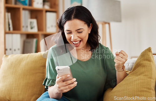Image of Phone, win and celebration, happy woman on sofa with notification on bonus, deal or discount offer online. Wow, social media and girl on couch with smile, cellphone and excited for surprise in home.