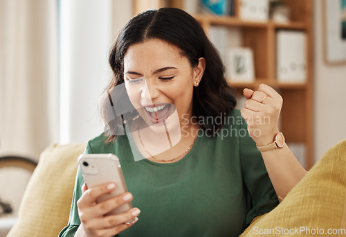 Image of Phone, winning and celebrate, happy woman on sofa with notification on bonus, deal or discount offer online. Win, social media and girl on couch with smile, cellphone and excited for surprise in home