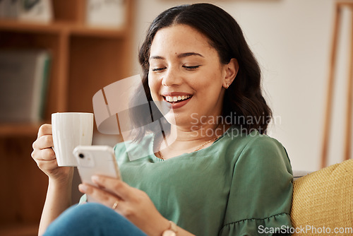 Image of Happy woman on sofa with phone, coffee and relax, reading email or social media meme in living room. Networking, cellphone and happiness, girl in home with smile, chat and internet search for post.