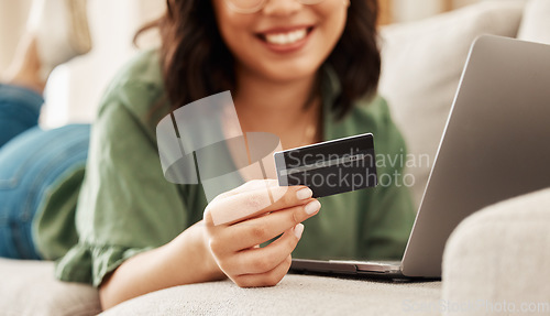 Image of Relax, online shopping and credit card, woman on sofa in living room for internet banking in home with laptop. Happy ecommerce payment, smile and cashback, girl on couch with computer on website sale