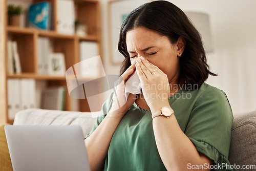 Image of Remote work, laptop and sick woman on a sofa with flu, cold or viral infection in her house. Freelance, sneeze and lady online with allergies, virus or burnout, sinusitis or hayfever while working