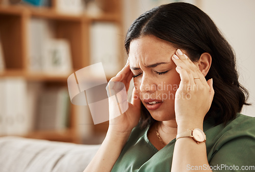 Image of Stress, headache and woman on a sofa with vertigo, brain fog or burnout in her home. Migraine, anxiety and female in a living room with problem fail or crisis, fatigue or mental health problem