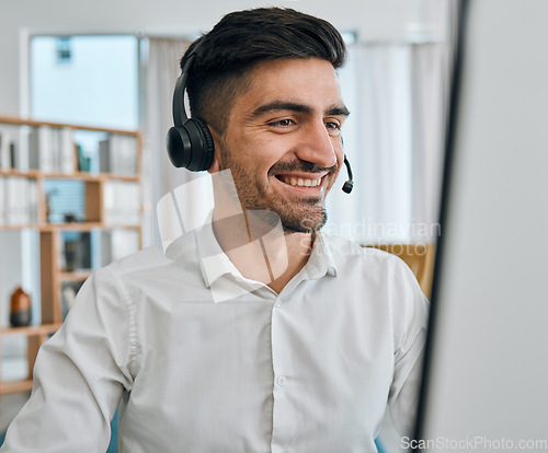 Image of Call center, man or happy consultant at computer for customer service, technical support or CRM consulting. Salesman, agent and telemarketing advisory at desktop for telecom, contact or FAQ questions