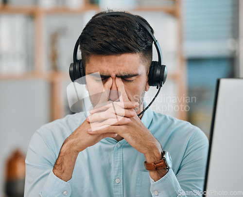 Image of Stress, call center and headache of man in customer service agency with pain, burnout or anxiety. Face, frustrated and tired salesman consulting with challenge, client problem and fatigue for mistake