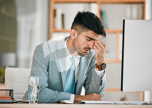 Image of Business man, headache and office computer with stress from auditor burnout at desk. Anxiety, eye pain and tired corporate worker with tech and tax deadline and fatigue from brain fog at company