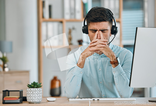 Image of Stress, call center or headache of man at computer, telemarketing agency and fail in pain, burnout or anxiety. Frustrated, sad or tired salesman in challenge, client problem and crisis of CRM mistake