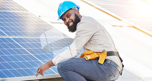 Image of Black man, portrait and technician in solar panel installation on rooftop in city for renewable energy. Happy African male person, engineer or contractor working on roof in sun for electricity power