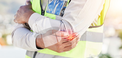 Image of Man, architect and hands with elbow pain in city from injury, accident or muscle tension on rooftop. Closeup of male person with sore arm bone, ache or joint inflammation during construction on site