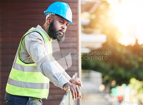 Image of Construction worker, man thinking and building inspection with industrial employee on a balcony. African male person, professional and builder with vision and safety for engineer project outdoor