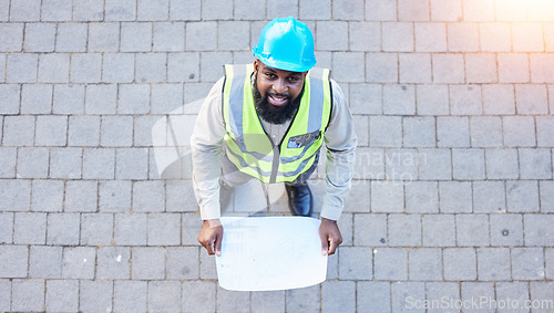 Image of Black man, portrait and architect with blueprint above for construction, planning or project ideas on site. Top view of male person, engineer or contractor with floor plan documents for architecture