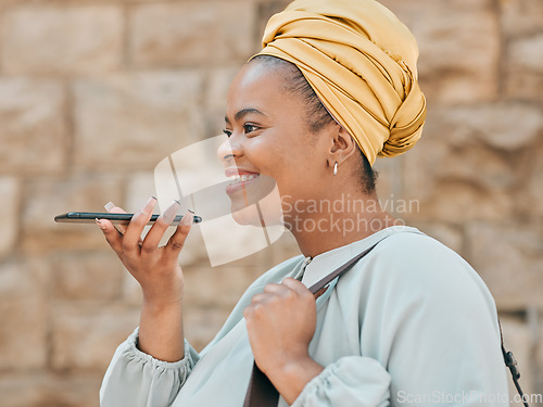 Image of Phone, voice recognition and woman in the city walking in an urban street to her office. Technology, happy and African female designer recording a message on cellphone while commuting in town road.