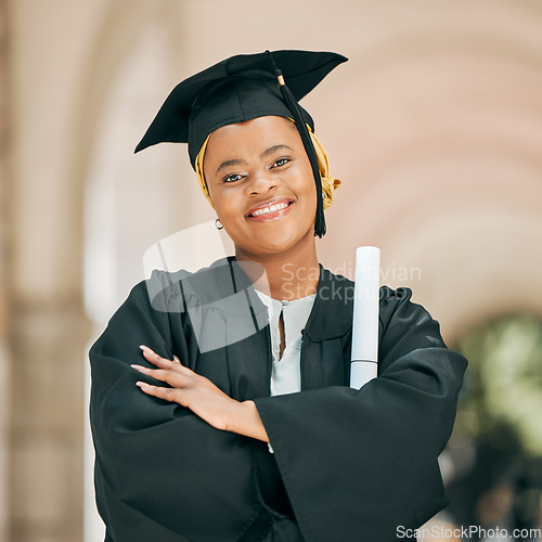 Image of Happy, smile and portrait of woman at graduation with degree, diploma or certificate scroll. Success, education and young African female university graduate with crossed arms for confidence on campus