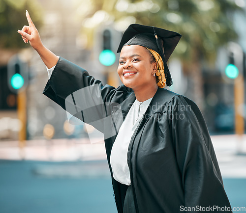 Image of City travel, student and black woman stop, point or hail taxi, cab or metro bus for transport ride to university graduation. Happy, education and African college person gesture for morning car trip