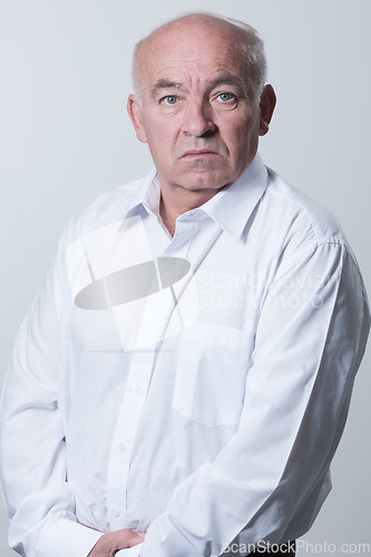 Image of Senior grey-haired man wearing elegant shirt isolated on white background depressed and worry for distress, crying angry and afraid. Sad expression.