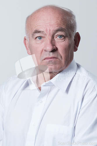 Image of Senior grey-haired man wearing elegant shirt isolated on white background depressed and worry for distress, crying angry and afraid. Sad expression.