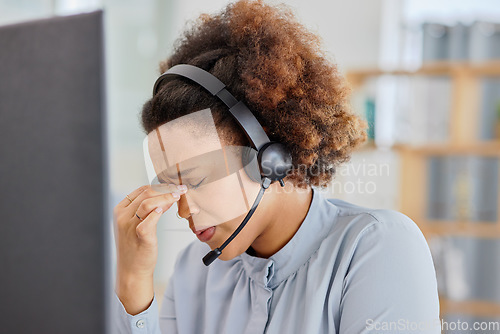 Image of Customer support, call center and woman with headache in office with tension, stress and pain. Telemarketing, business and overworked female person with burnout, strain and injury for crm service