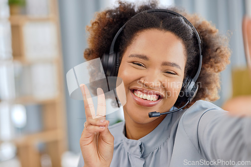 Image of Callcenter, selfie and happy woman at help desk with peace sign for advice, sales and telemarketing in headset. Consulting, emoji and virtual assistant, customer service agent or hand gesture for crm