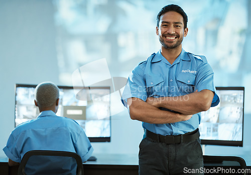 Image of Portrait, security and man with smile in control room as employee at agency with asian. Face, safety, professional and working at data centre for surveillance for crime on video with technology.