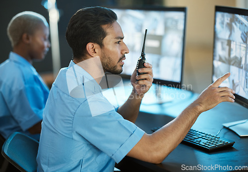 Image of Control room, safety and security guard with a radio and computer screen for surveillance. Man and woman team together for crime investigation, cctv monitor and communication with a walkie talkie