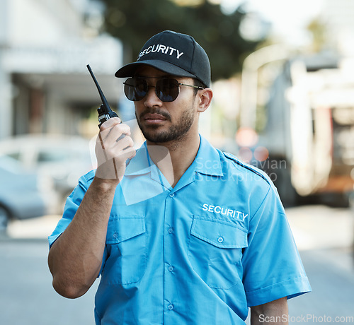 Image of Walkie talkie, man and a security guard or safety officer outdoor on a city road with communication. Serious male person with radio on urban street to report crime for investigation and surveillance