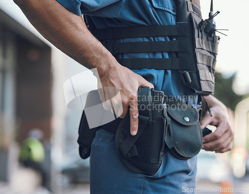 Image of Security, police and hands of man with gun in city for shift, inspection and supervision on patrol. Weapon, law enforcement and closeup of male person in town for safety, crime and protection service