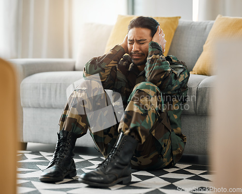 Image of Soldier, sad and ptsd with man in living room for depression, stress and psychology. Army, military and war veteran with person and trauma at home for mental health, bipolar and schizophrenia problem
