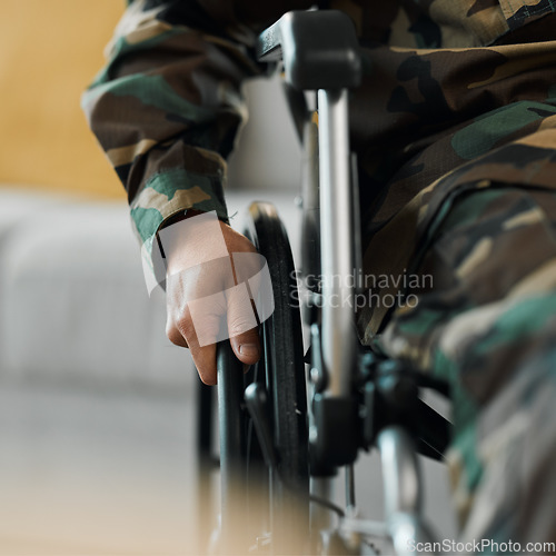 Image of Man, hands and wheelchair in army from accident, war injury or healthcare support at hospital. Closeup of soldier or person with a disability holding wheel in commitment for recovery or physiotherapy