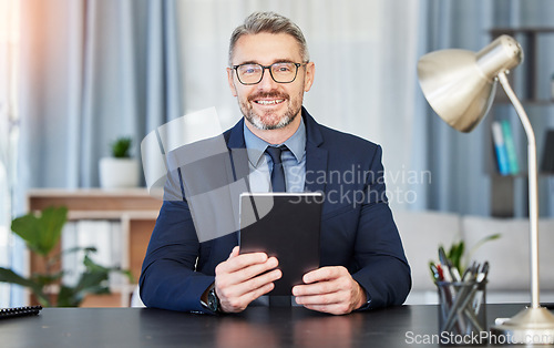 Image of Professional man, glasses and tablet in portrait at a desk for success at office with financial manager. Leader, nerd and face with technology at table with positive expression for business at work.