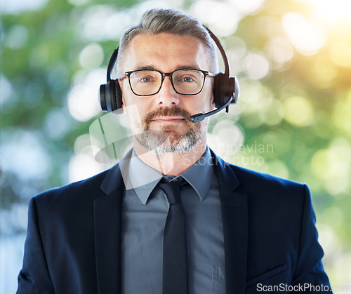 Image of Call center, portrait and senior man with headset, CRM and contact us with communication and professional headshot. Telecom, customer service and male consultant with help desk employee and mic