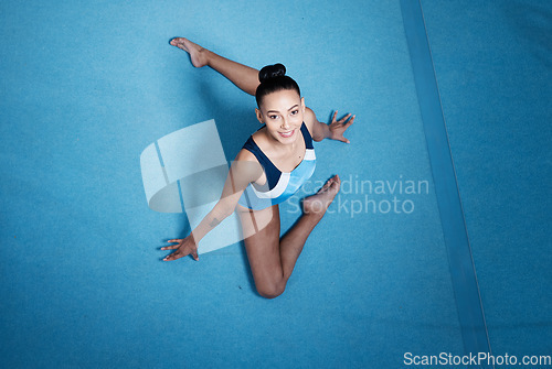 Image of Woman, top view and gymnastics with fitness and athlete, stretching and workout routine with mockup space. Female gymnast, exercise and flexibility with health and sports in gym, training and body