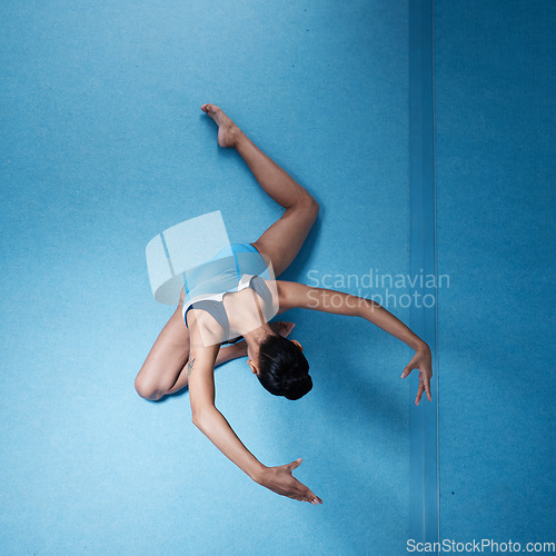 Image of Woman, gymnastics with fitness and athlete, stretching and workout routine with mockup space and top view. Female gymnast, exercise and flexibility with health and sports in gym, training and body