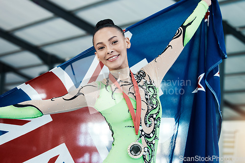 Image of Medal, winner of gymnastics and portrait of champion with union jack, success in competition or gold, prize or award from achievement. Winning, athlete and celebration on podium in stadium or arena