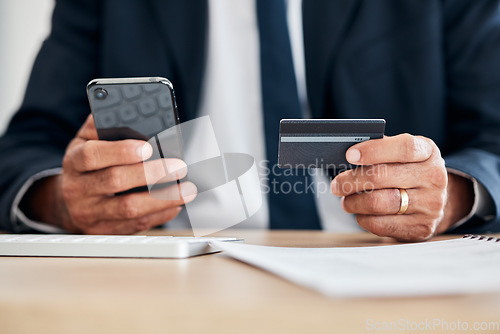 Image of Hands, phone or businessman with credit card for an online shopping on financial digital fintech in office. Mobile app, ecommerce payment closeup or accountant typing banking data for investment