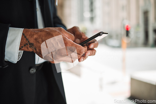 Image of Hands, phone and navigation with a business man in the city using an app to search for a location or direction. Mobile, travel and communication with a male employee typing a text message closeup