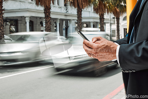 Image of Hands, phone and commute with a business man in the city using an app for location, navigation or direction. Mobile, travel and communication with a male employee typing a message in an urban town