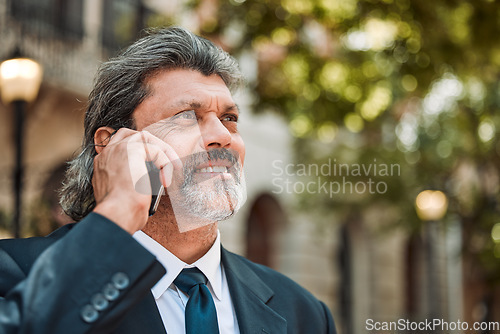 Image of Phone call, thinking and vision with a business man in the city on his morning commute into work. Mobile, face and smile with a senior male CEO or manager talking while in an urban town for travel