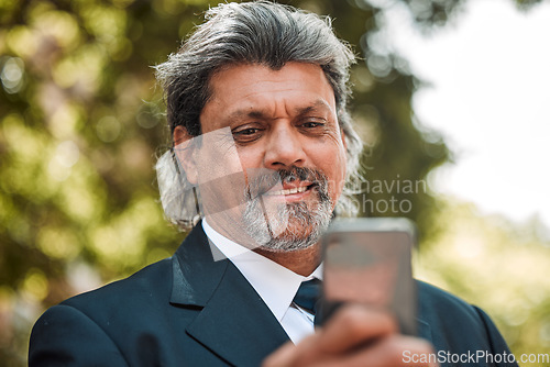 Image of Face, phone and communication with a business man outdoor on his morning commute for work. Mobile, contact and networking with a senior male CEO or manager reading a text message or social media post