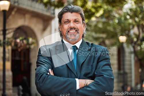 Image of Senior man, executive with arms crossed and smile in portrait outdoor, career success and pride in business. Professional mindset, male CEO and confidence, happy in city with company vision and goals