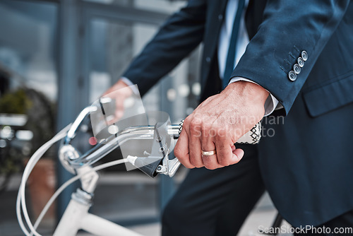 Image of Businessman, cycling or riding with hands on bike for eco friendly travel, transport or commute to office, building or work in the city. Man, driving and bicycle for carbon neutral footprint in town