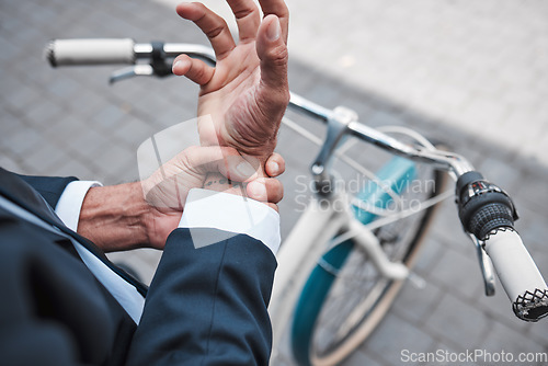 Image of Wrist pain, hands and city business person with anatomy injury, hurt bone fracture and on urban bike travel. Trauma accident, morning bicycle commute and closeup worker with arthritis risk emergency