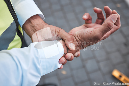 Image of Wrist pain, hands and city person, architect or construction worker with anatomy injury, fracture or trauma accident. Carpal tunnel syndrome, urban and closeup civil engineer with arthritis risk