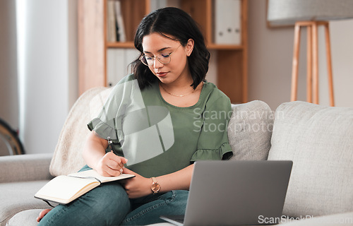 Image of Woman, student and laptop, writing in notebook and planning schedule, work from home or online education on sofa. Person with journal ideas or studying in college or university e learning on computer