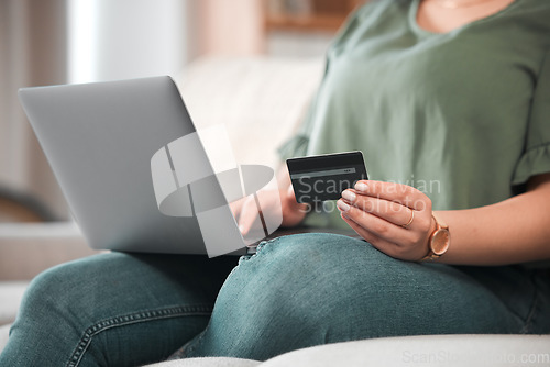 Image of Hand, laptop and credit card for ecommerce with a customer on the internet from home. Computer, online shopping and payment with a person using a bank app for finance, accounting or budget planning