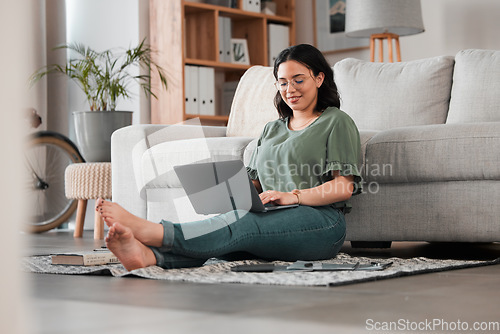 Image of Woman, remote work and laptop on floor of living room for digital planning, online research and elearning. Happy freelancer working on computer technology for telework, social media and blog at home